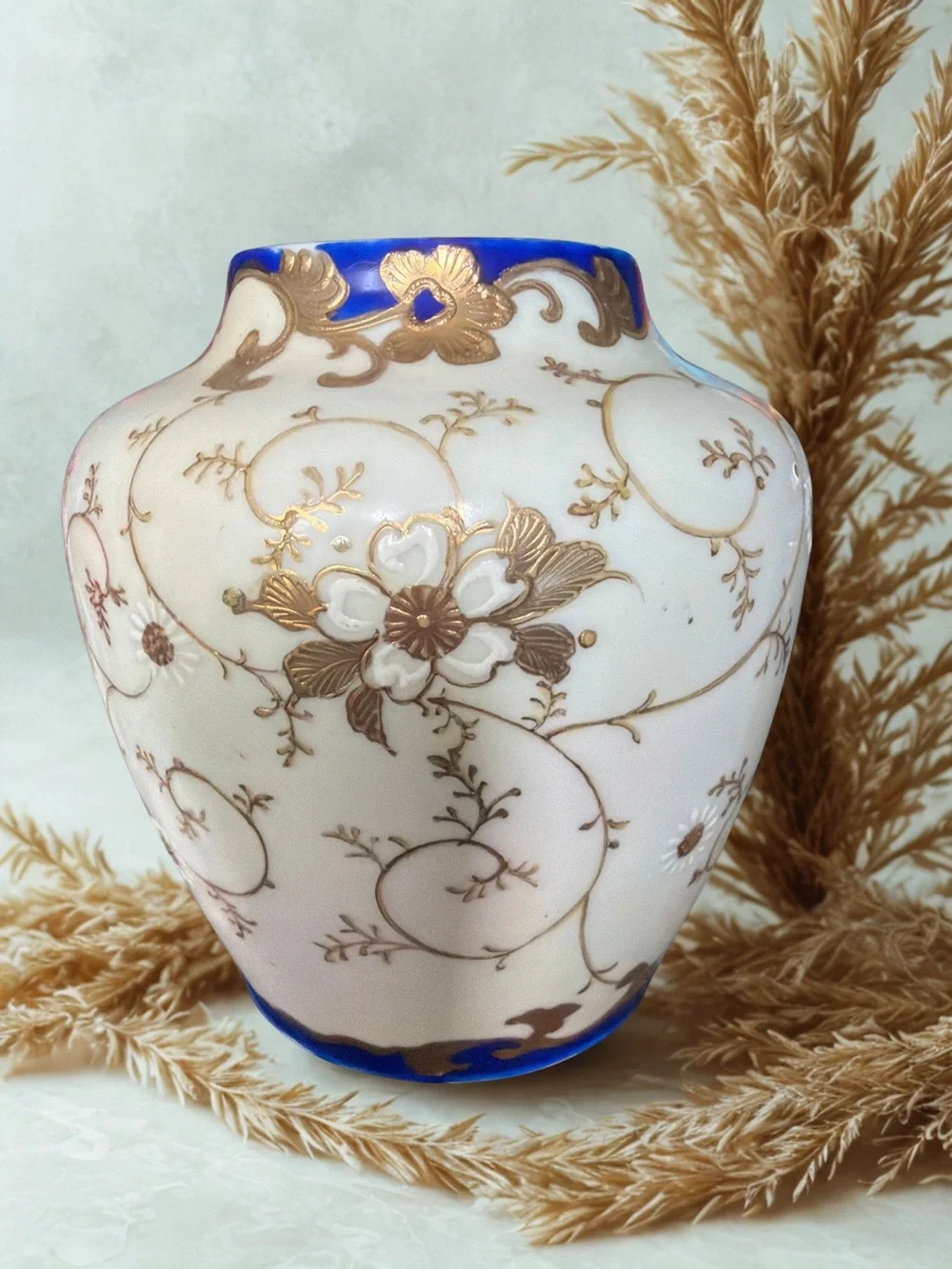 White and Cobalt Blue Porcelain Vase with Gold Floral Accents